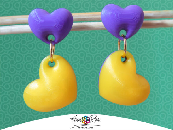 ARETES CORAZONES X2 AMARILLO MORADO